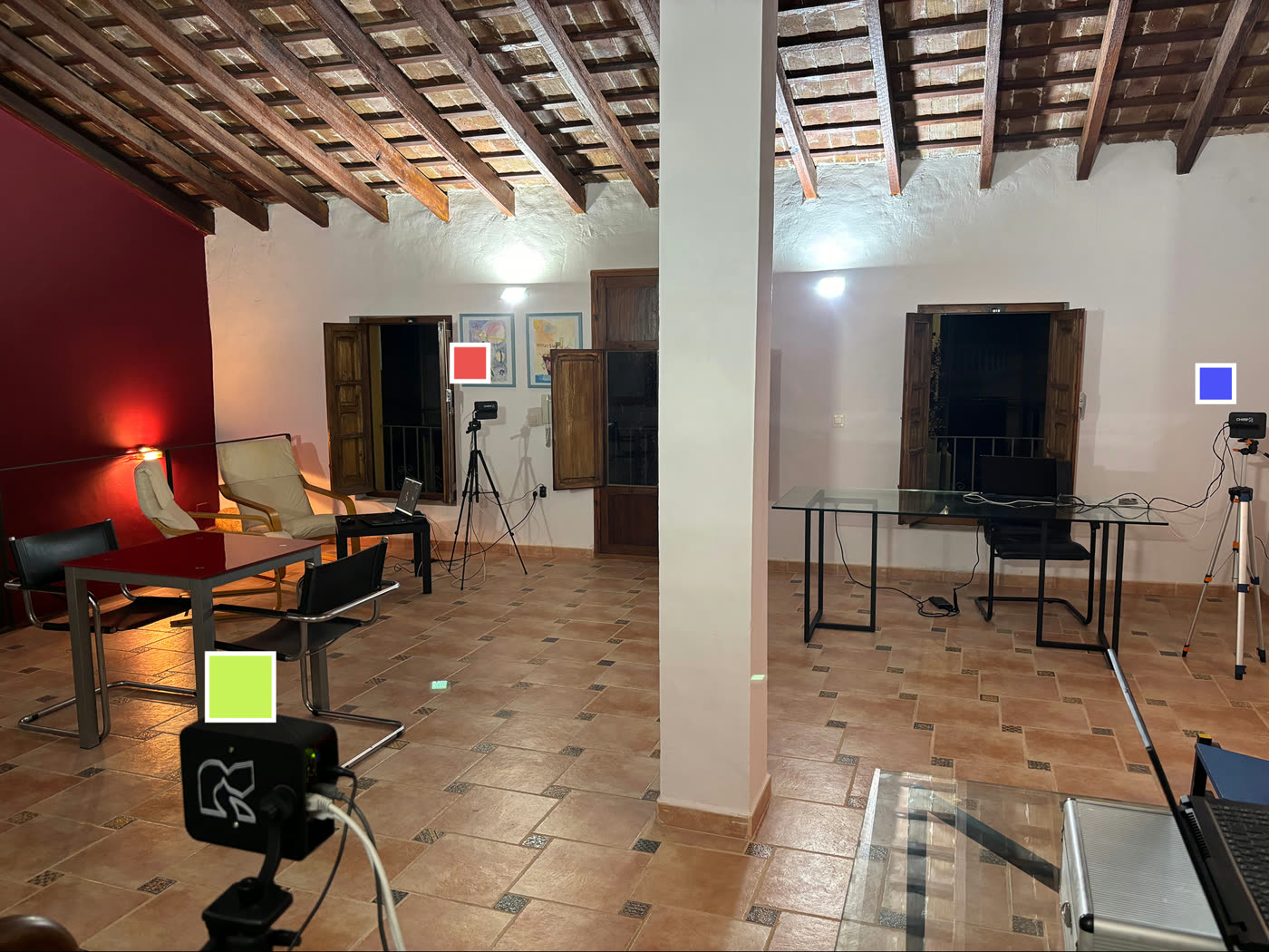 Indoor room with three CHIRP FMCW sensors on tripods, marked with red, blue and green squares